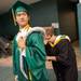 Huron student Zibo Zou, the last student to walk during the graduation ceremony, has the river rats rattail pined to him before the start of ceremony.
Courtney Sacco I AnnArbor.com